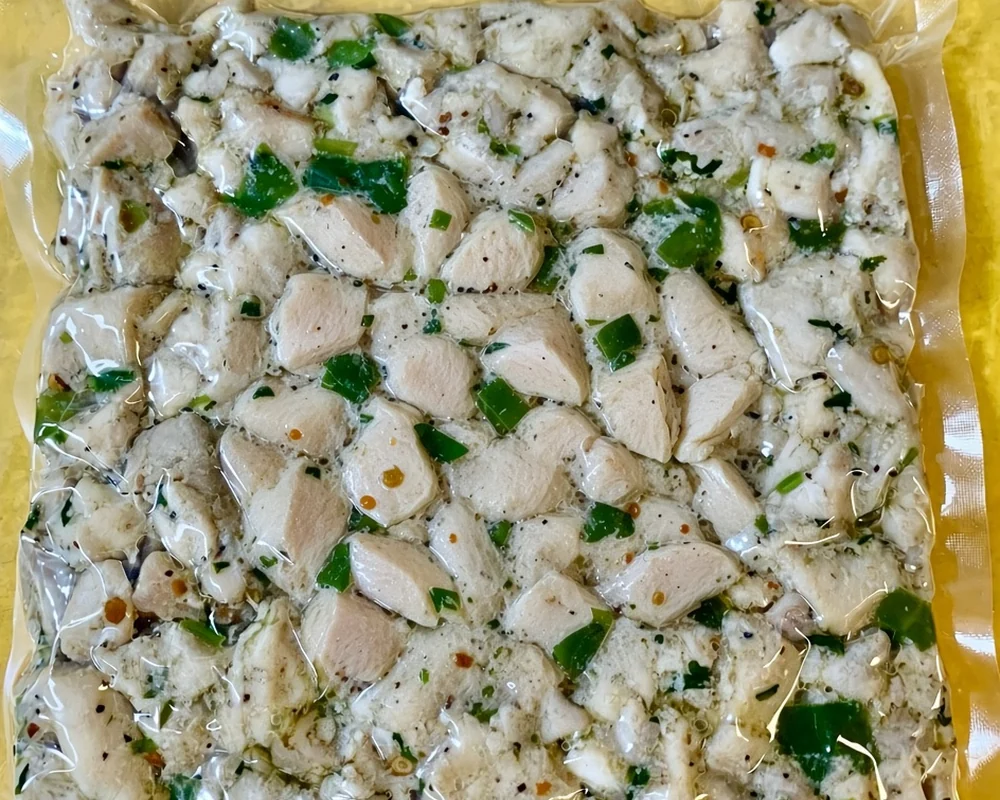 Tres Marias Pimienta Chicken, raw chicken pieces marinated with peppers and spices in a vacuum pack, Calgary, AB